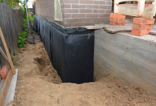 Happy homeowners after waterproofing job in Fredericksburg
